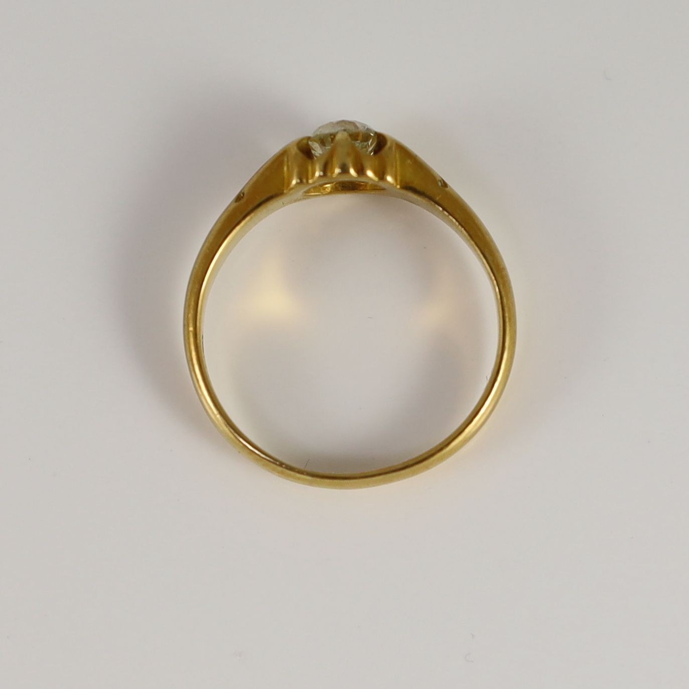 A late Victorian 18ct gold and claw set oval cushion cut diamond set ring